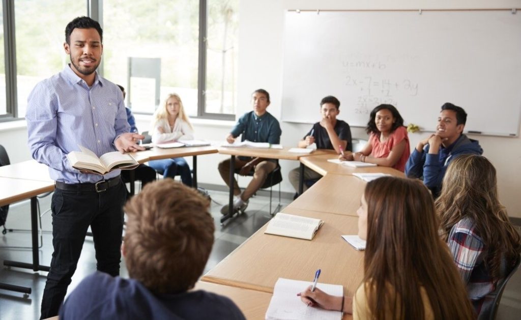 English Language Arts teacher and students in a classroom setting.