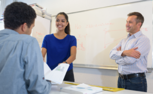 Photo of teacher training and mentoring a new teacher