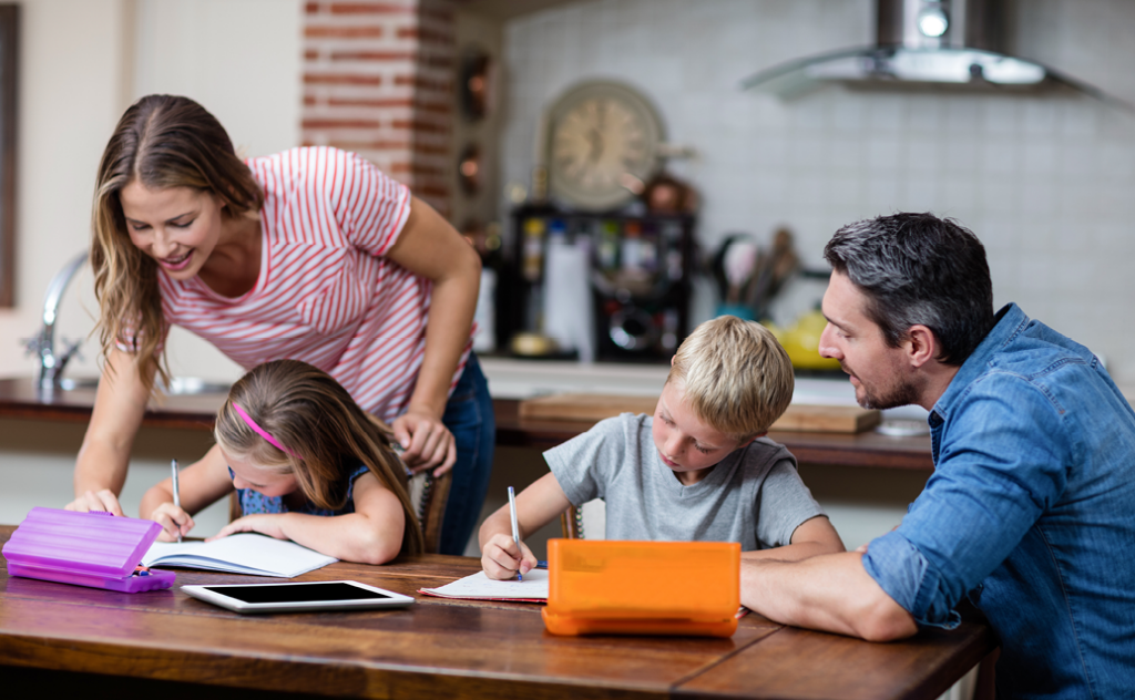 Parents helping young children with homework