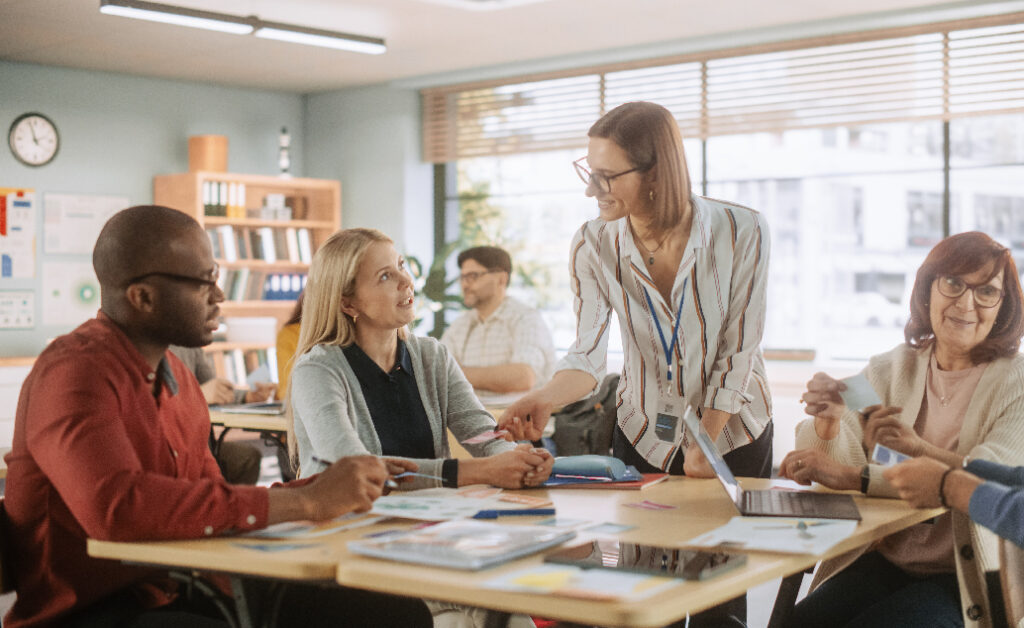 Photo of administrator helping teachers