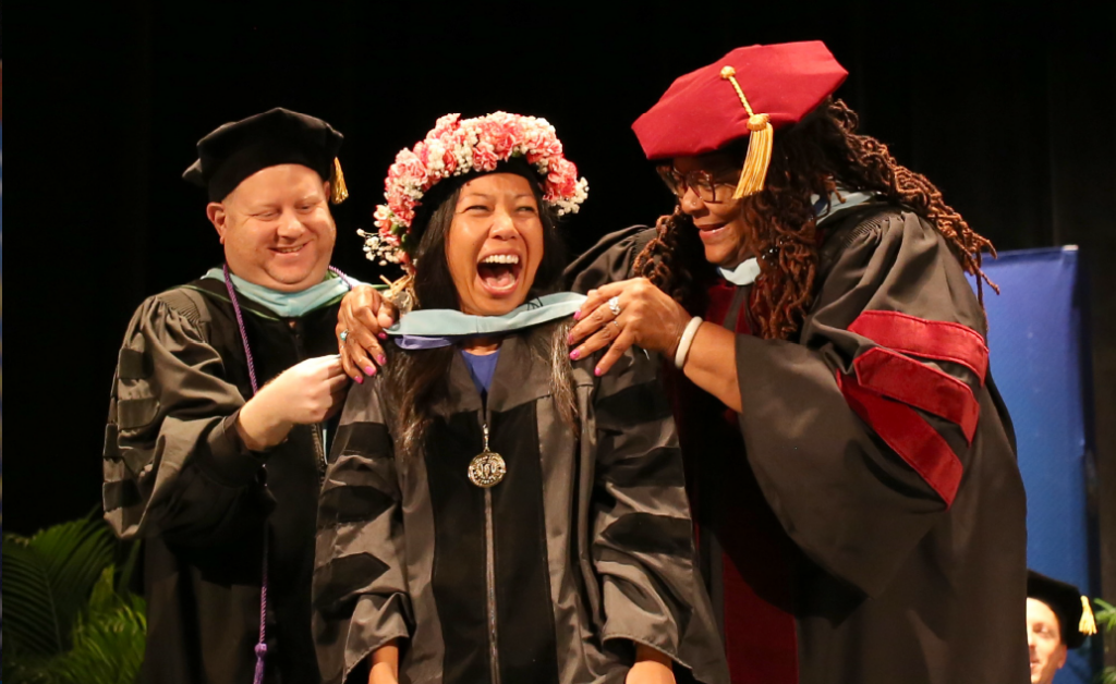 Image of American College of Education graduate earning a doctoral degree