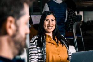 Two ACE Workers Reviewing Upskilling and New Job Opportunities on Their Laptops.