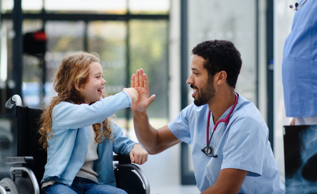 image of nurse giving a patient a high five