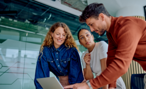 A team of data analysts going over business intelligence reports.